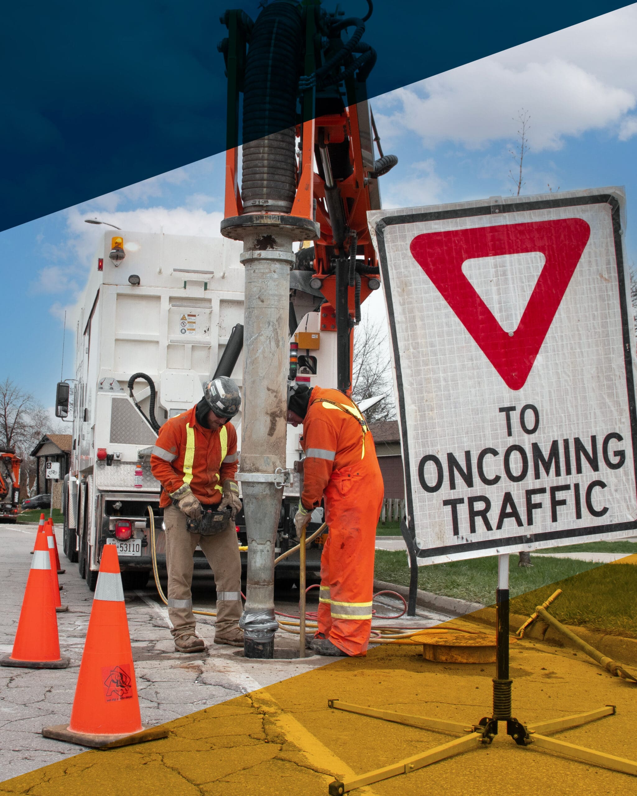Vacuum-excavation crew working on an active site with a hydrovac truck and utility trenching work underway.